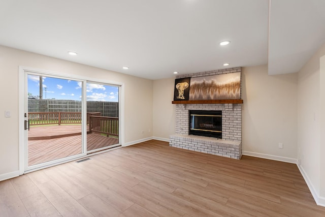 747 Jamestowne Ct, Sleepy Hollow, IL 60118 - unfurnished living room with wood finished floors, a fireplace, and recessed lighting