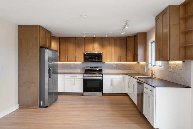 747 Jamestowne Ct, Sleepy Hollow, IL 60118 - kitchen featuring stainless steel appliances, open shelves, dark countertops, light wood-style flooring, and tasteful backsplash