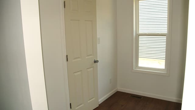 459 Talma St, Aurora, IL 60505 - unfurnished room with baseboards and dark wood-style floors