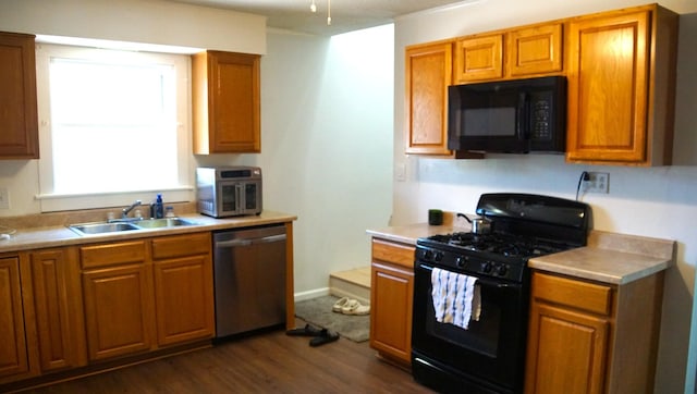 459 Talma St, Aurora, IL 60505 - kitchen with black appliances, dark wood-type flooring, brown cabinetry, and light countertops