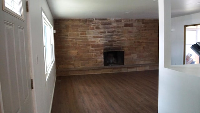 459 Talma St, Aurora, IL 60505 - unfurnished living room with wood finished floors, plenty of natural light, and a fireplace