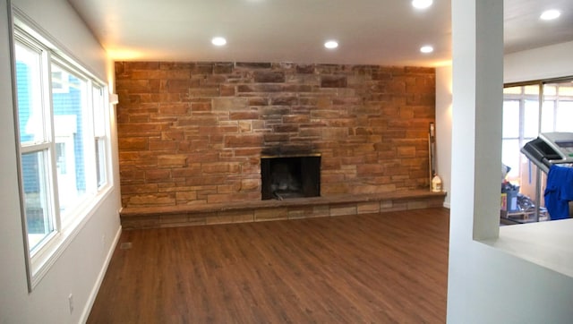 459 Talma St, Aurora, IL 60505 - living area featuring healthy amount of natural light, wood finished floors, a fireplace, and recessed lighting