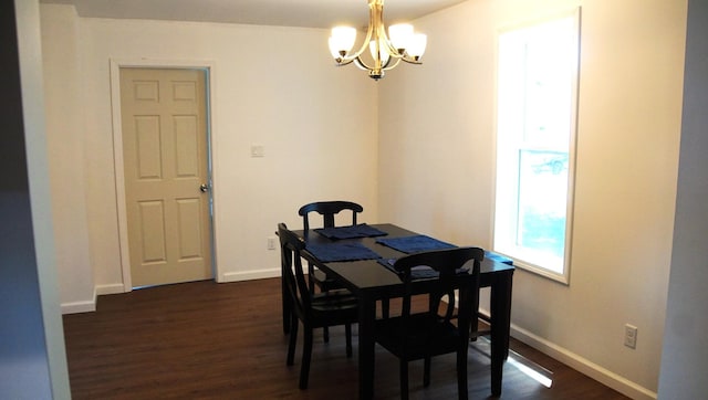 459 Talma St, Aurora, IL 60505 - dining area with a chandelier and dark wood-type flooring