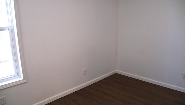 459 Talma St, Aurora, IL 60505 - empty room featuring dark wood-type flooring and baseboards