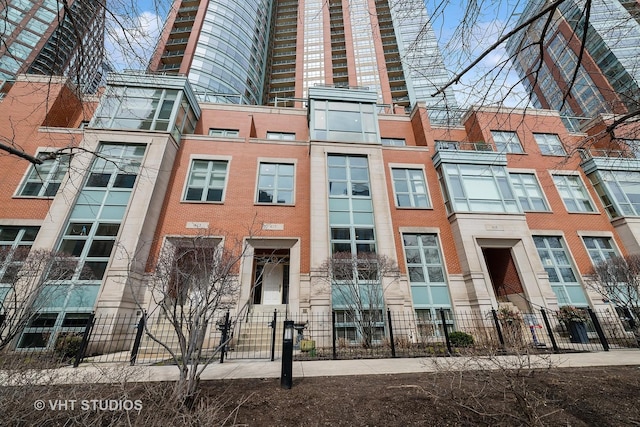 417 E N Water St, Chicago, IL 60611 - view of apartment building / complex featuring a fenced front yard