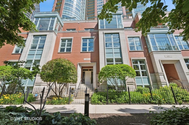 417 E N Water St, Chicago, IL 60611 - view of front of home with a gate and a fenced front yard