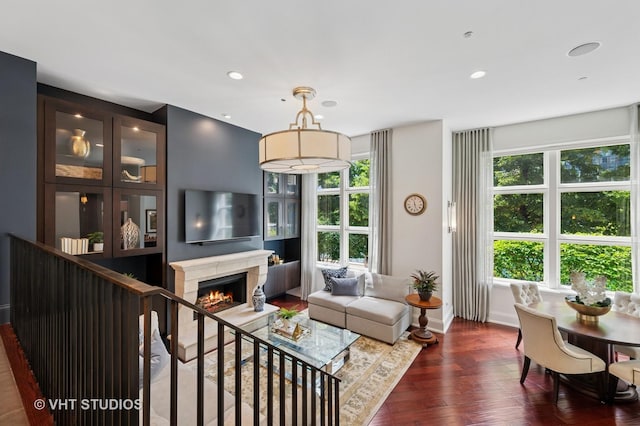 417 E N Water St, Chicago, IL 60611 - living area with plenty of natural light, dark wood-style floors, a lit fireplace, and recessed lighting