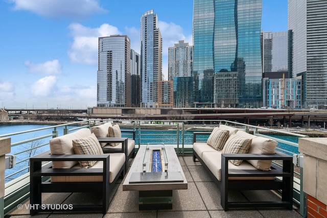 417 E N Water St, Chicago, IL 60611 - view of pool featuring an outdoor living space with a fire pit, a view of skyline, and a water view