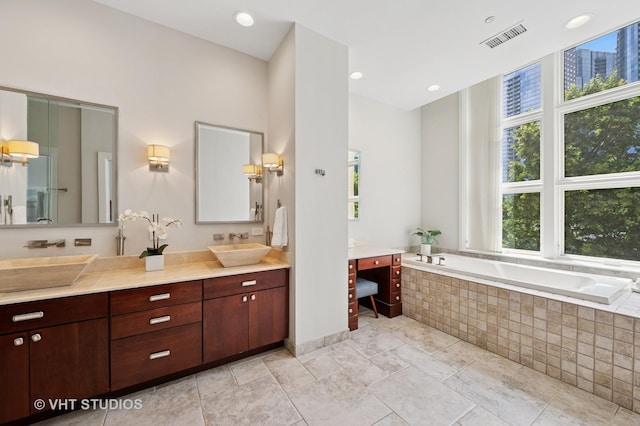 417 E N Water St, Chicago, IL 60611 - full bathroom with healthy amount of natural light, double vanity, and a garden tub