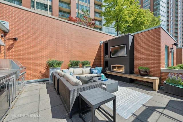 417 E N Water St, Chicago, IL 60611 - view of patio / terrace with an outdoor living space with a fireplace and a grill