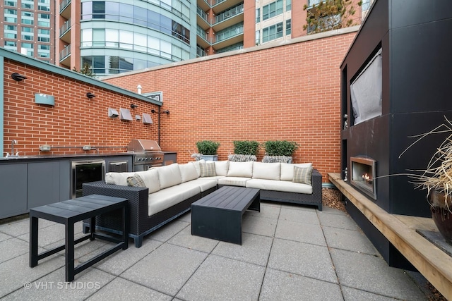 417 E N Water St, Chicago, IL 60611 - view of patio / terrace with area for grilling, an outdoor living space with a fireplace, and wine cooler