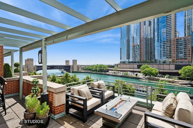 417 E N Water St, Chicago, IL 60611 - view of patio / terrace featuring a water view, an outdoor living space with a fire pit, and a view of city