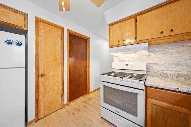2317 W 50th St, Chicago, IL 60609 - kitchen with white appliances, under cabinet range hood, decorative backsplash, light wood-style flooring, and ceiling fan