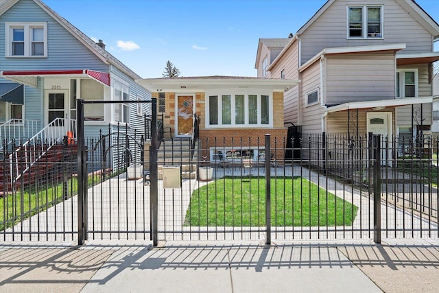 2317 W 50th St, Chicago, IL 60609 - view of front facade with a fenced front yard and brick siding