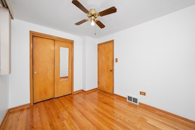 2317 W 50th St, Chicago, IL 60609 - unfurnished bedroom with light wood finished floors, a closet, and ceiling fan