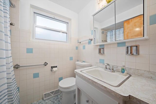 2317 W 50th St, Chicago, IL 60609 - bathroom featuring tile walls, a shower with shower curtain, vanity, and tile patterned floors