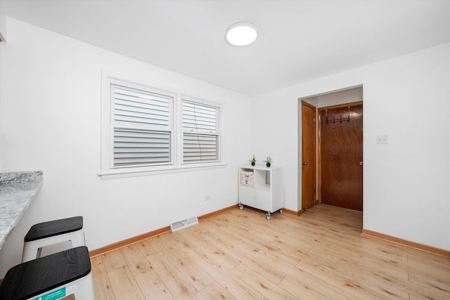 2317 W 50th St, Chicago, IL 60609 - unfurnished room with light wood-type flooring and baseboards