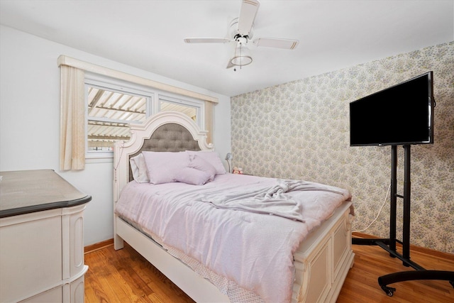 2317 W 50th St, Chicago, IL 60609 - bedroom featuring light wood-type flooring, wallpapered walls, and a ceiling fan
