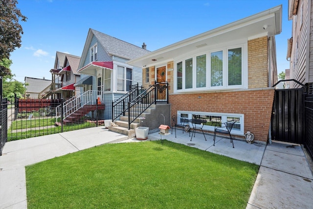 2317 W 50th St, Chicago, IL 60609 - view of front of property with brick siding and a patio
