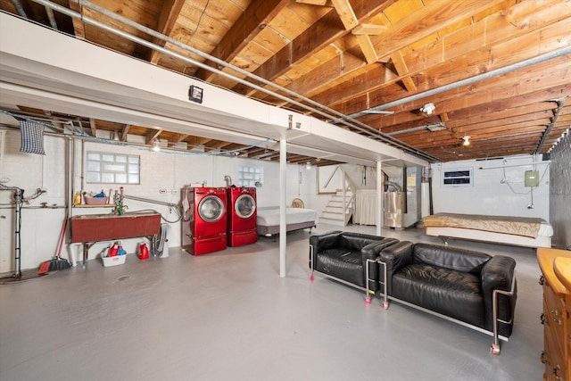 2317 W 50th St, Chicago, IL 60609 - below grade area featuring washer and dryer, water heater, and stairs