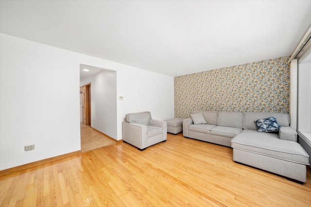 2317 W 50th St, Chicago, IL 60609 - living area featuring an accent wall, wallpapered walls, and wood finished floors