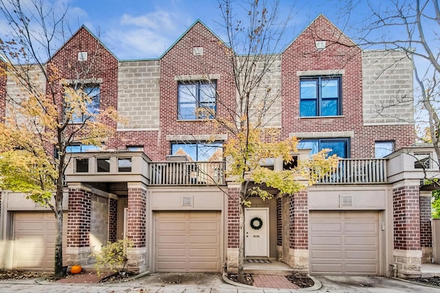 2743 N Wayne Ave Unit B, Chicago, IL 60614 - multi unit property featuring a balcony, brick siding, a garage, and driveway
