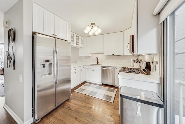 2743 N Wayne Ave Unit B, Chicago, IL 60614 - kitchen featuring stainless steel appliances, dark wood-type flooring, and white cabinets