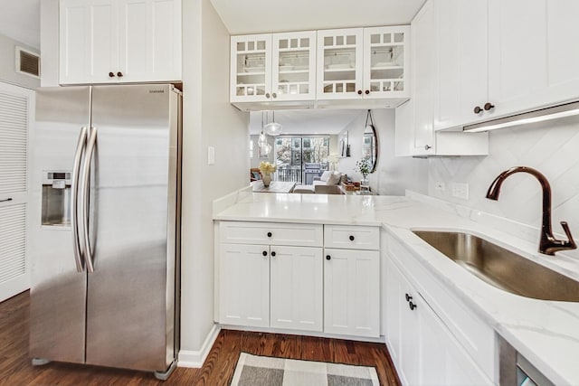 2743 N Wayne Ave Unit B, Chicago, IL 60614 - kitchen featuring stainless steel fridge with ice dispenser, dark wood-style floors, glass insert cabinets, and white cabinetry