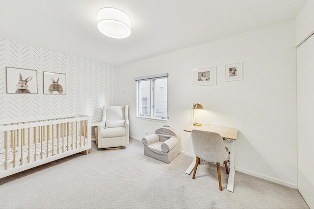 2743 N Wayne Ave Unit B, Chicago, IL 60614 - carpeted bedroom featuring an accent wall, a crib, and wallpapered walls