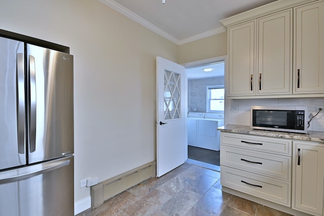 7851 W Cressett Dr, Elmwood Park, IL 60707 - kitchen featuring stainless steel appliances, washing machine and clothes dryer, crown molding, and light stone counters