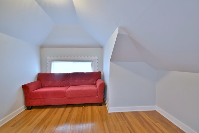 7851 W Cressett Dr, Elmwood Park, IL 60707 - living area featuring wood finished floors and vaulted ceiling