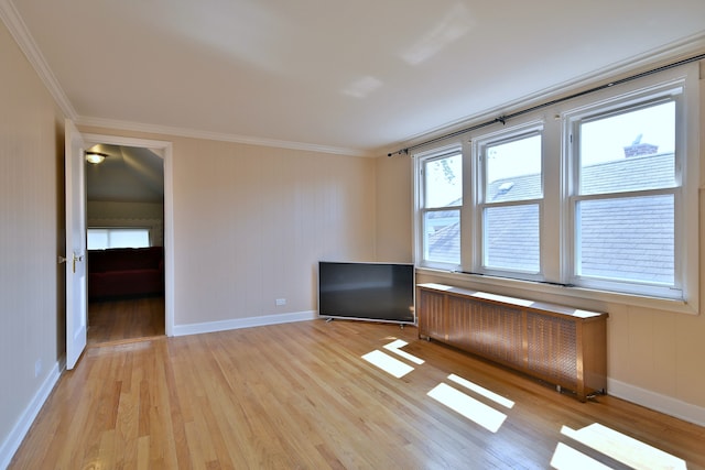 7851 W Cressett Dr, Elmwood Park, IL 60707 - empty room with light wood-style flooring, crown molding, and radiator heating unit