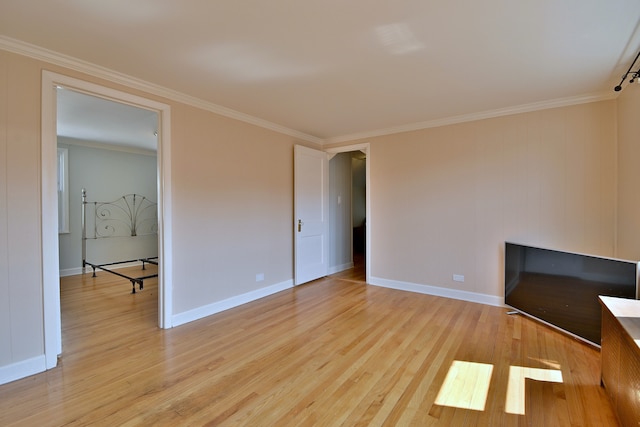 7851 W Cressett Dr, Elmwood Park, IL 60707 - unfurnished living room with light wood-style flooring and ornamental molding