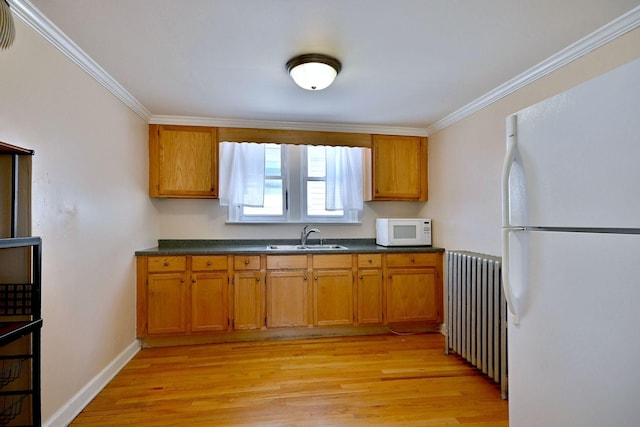 7851 W Cressett Dr, Elmwood Park, IL 60707 - kitchen with white appliances, radiator heating unit, dark countertops, brown cabinets, and light wood-type flooring