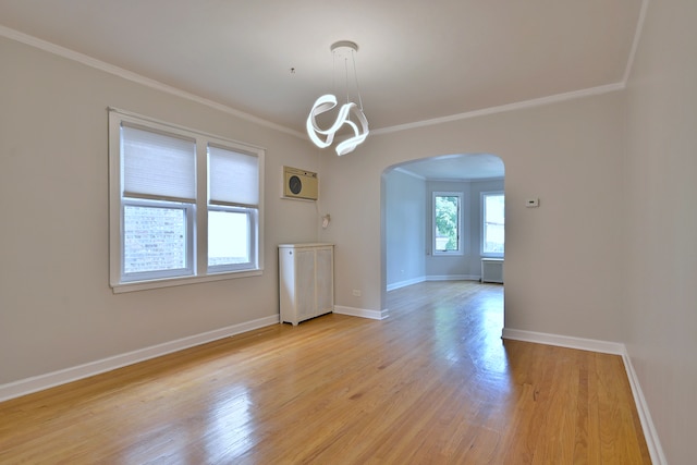 7851 W Cressett Dr, Elmwood Park, IL 60707 - empty room with arched walkways, crown molding, light wood-style floors, and a chandelier