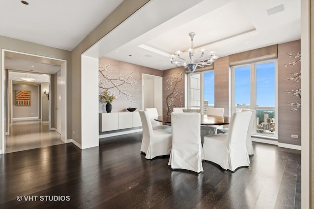 11 E Walton St Unit 4902, Chicago, IL 60611 - dining space featuring a chandelier, wood finished floors, and a tray ceiling