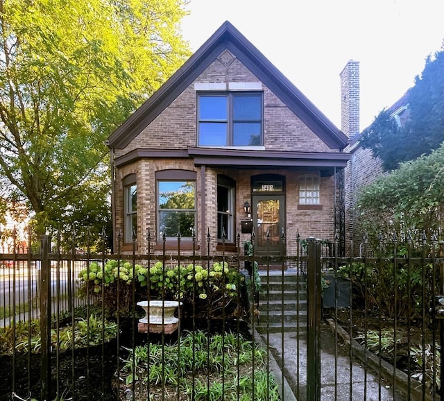 3401 W Beach Ave, Chicago, IL 60651 - view of front of home featuring a fenced front yard, covered porch, a gate, a chimney, and brick siding