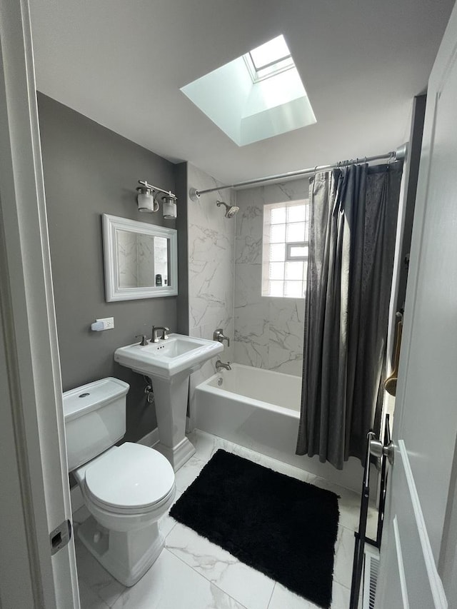3401 W Beach Ave, Chicago, IL 60651 - full bath featuring shower / bath combination with curtain, a skylight, and marble finish flooring