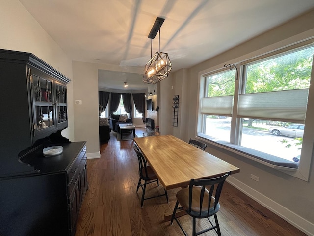 3401 W Beach Ave, Chicago, IL 60651 - dining area with dark wood-style floors and baseboards