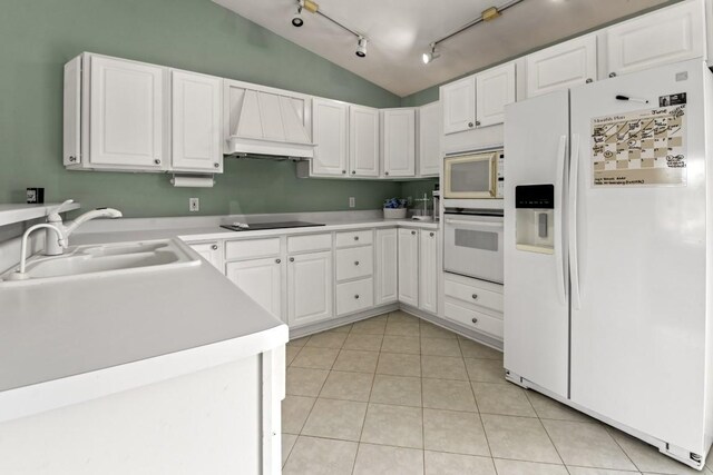 6072 Nimtz Ct, Loves Park, IL 61111 - kitchen featuring white appliances, track lighting, vaulted ceiling, custom exhaust hood, and light tile patterned floors
