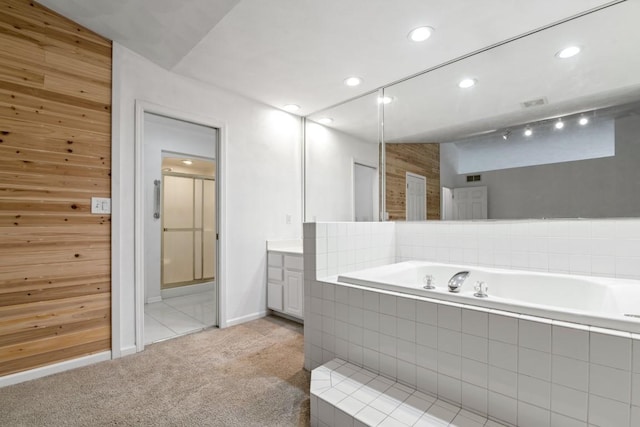 6072 Nimtz Ct, Loves Park, IL 61111 - full bathroom featuring vanity, a bath, a shower stall, recessed lighting, and wood walls