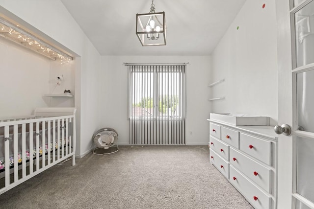 6072 Nimtz Ct, Loves Park, IL 61111 - bedroom with a chandelier, carpet, and a nursery area