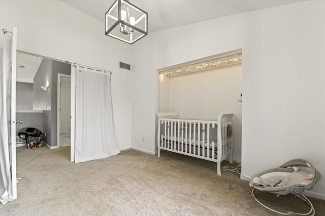 6072 Nimtz Ct, Loves Park, IL 61111 - bedroom featuring carpet floors, a crib, and a chandelier