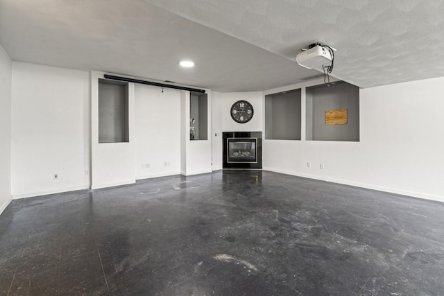 6072 Nimtz Ct, Loves Park, IL 61111 - unfurnished living room featuring a glass covered fireplace, concrete flooring, and recessed lighting