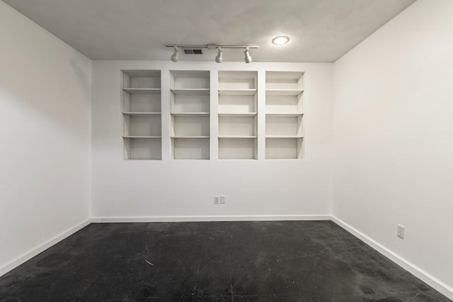 6072 Nimtz Ct, Loves Park, IL 61111 - empty room featuring baseboards and track lighting