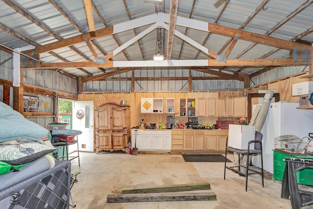 944 E County Line Rd, Beecher, IL 60401 - garage featuring freestanding refrigerator and wooden walls