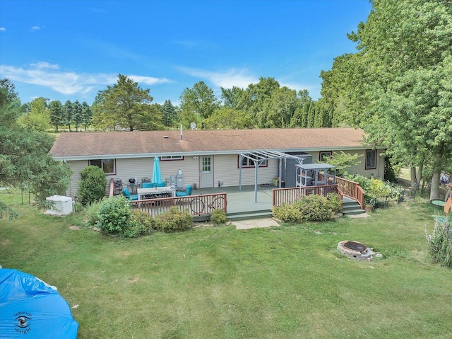 944 E County Line Rd, Beecher, IL 60401 - rear view of property with an outdoor fire pit, a wooden deck, and a yard