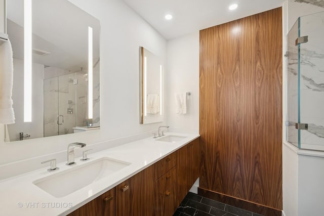 1300 N Lake Shore Dr Unit 21D, Chicago, IL 60610 - bathroom with a marble finish shower, double vanity, recessed lighting, and tile patterned floors