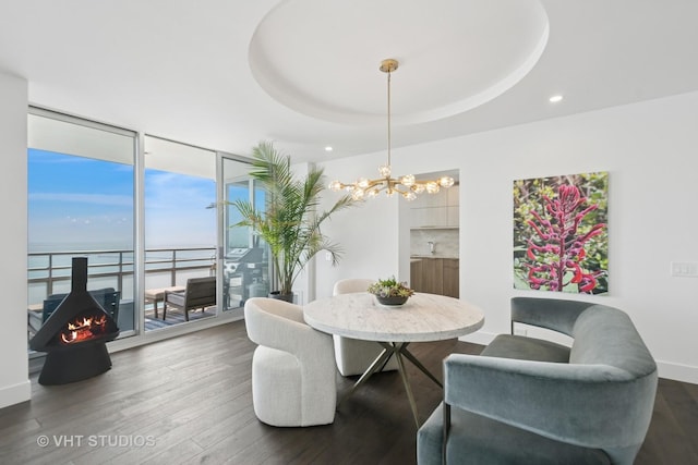 1300 N Lake Shore Dr Unit 21D, Chicago, IL 60610 - dining area with a chandelier, dark wood-type flooring, a wall of windows, a water view, and recessed lighting