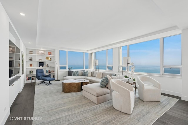 1300 N Lake Shore Dr Unit 21D, Chicago, IL 60610 - living room featuring plenty of natural light, wood finished floors, recessed lighting, and a water view